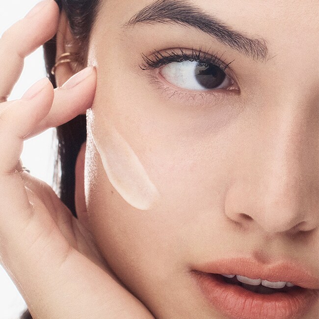 Model removing makeup with our gentle yet powerful Soothing Cleansing Oil