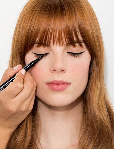 Applying Eye Liner